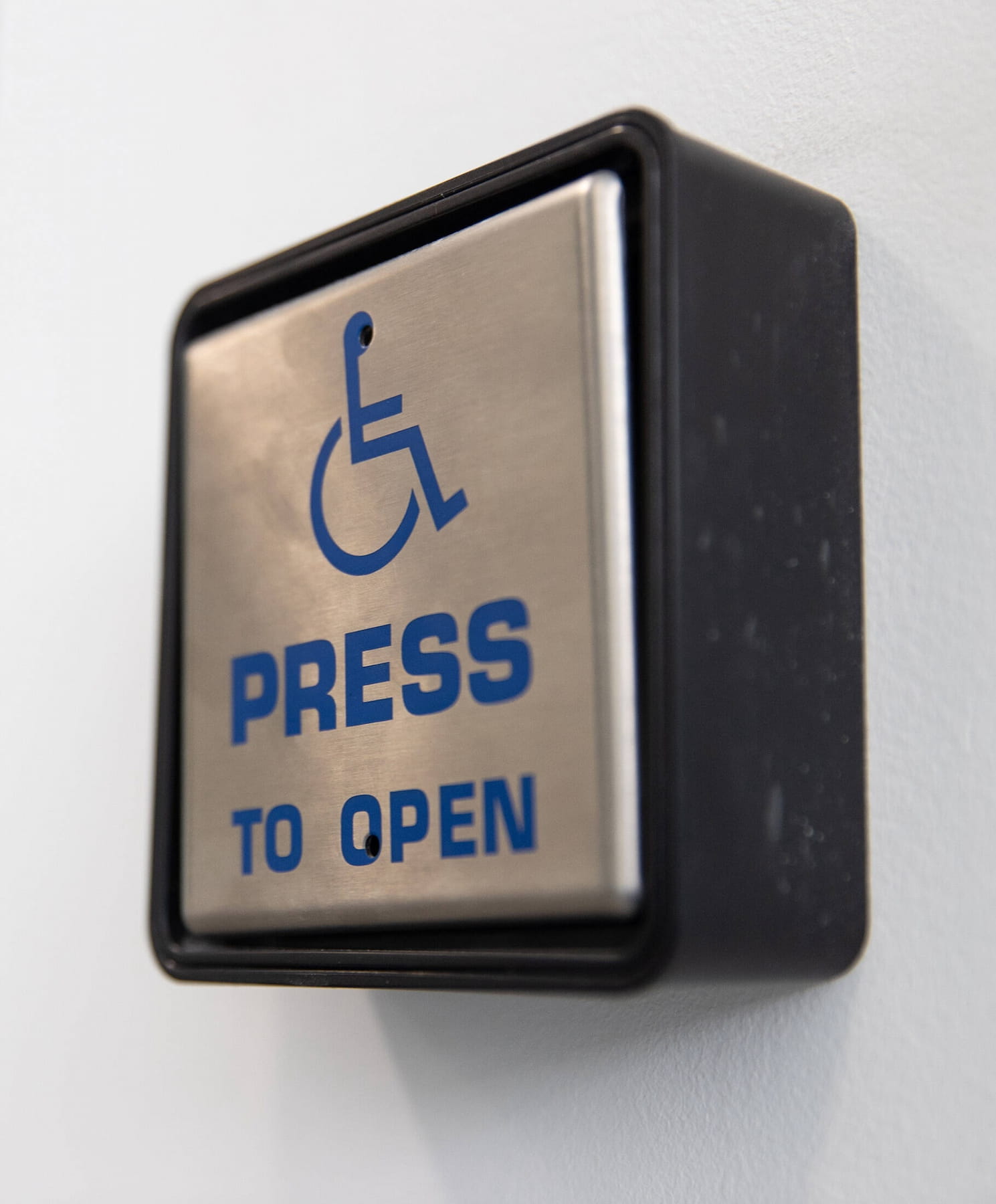 Close up of disabled access door button